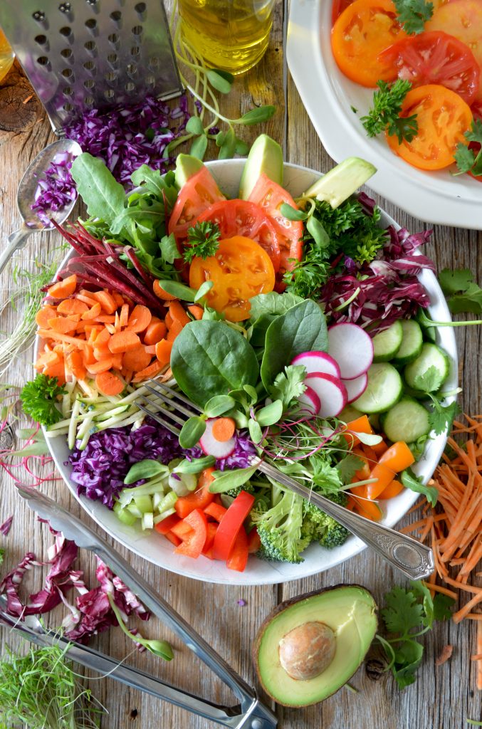 Eating a healthy salad - How To Manifest a Super Fast Metabolism With Lifestyle Changes in 2022