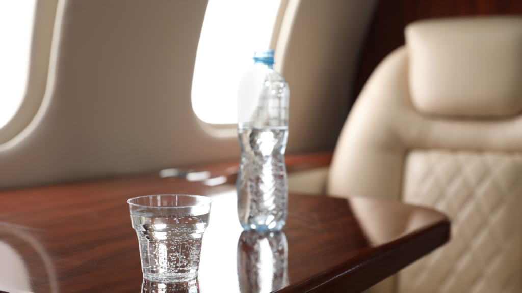 water and glass on an airplane