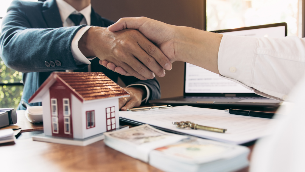 Shaking hand with real estate agent
